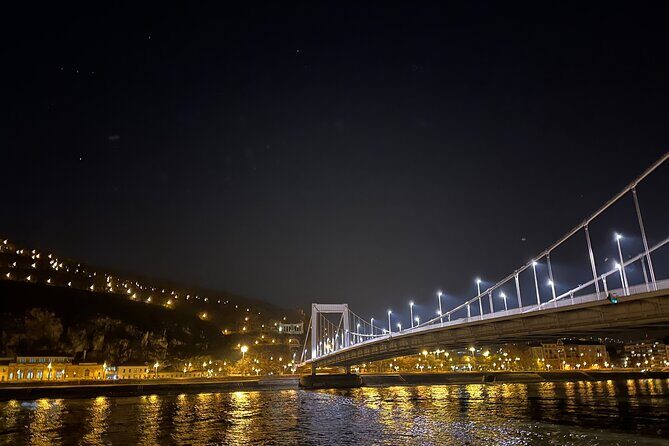 Bright Lights of Budapest Night Tour with Boat Cruise and Wine - Budapest Parliament and Széchenyi Chain Bridge: exterior views that set up the river