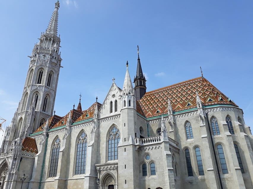 Budapest: Buda Castle Walking Tour & Folk Music Performance - Matthias Church and Fisherman’s Bastion: The First Big Icons