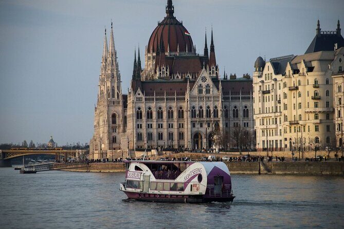 Mulled Wine Danube Cruise with Audio Guide in Budapest - Ship setup: warm indoor space and a photo-friendly top deck